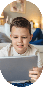 Child on a tablet in a living room setting