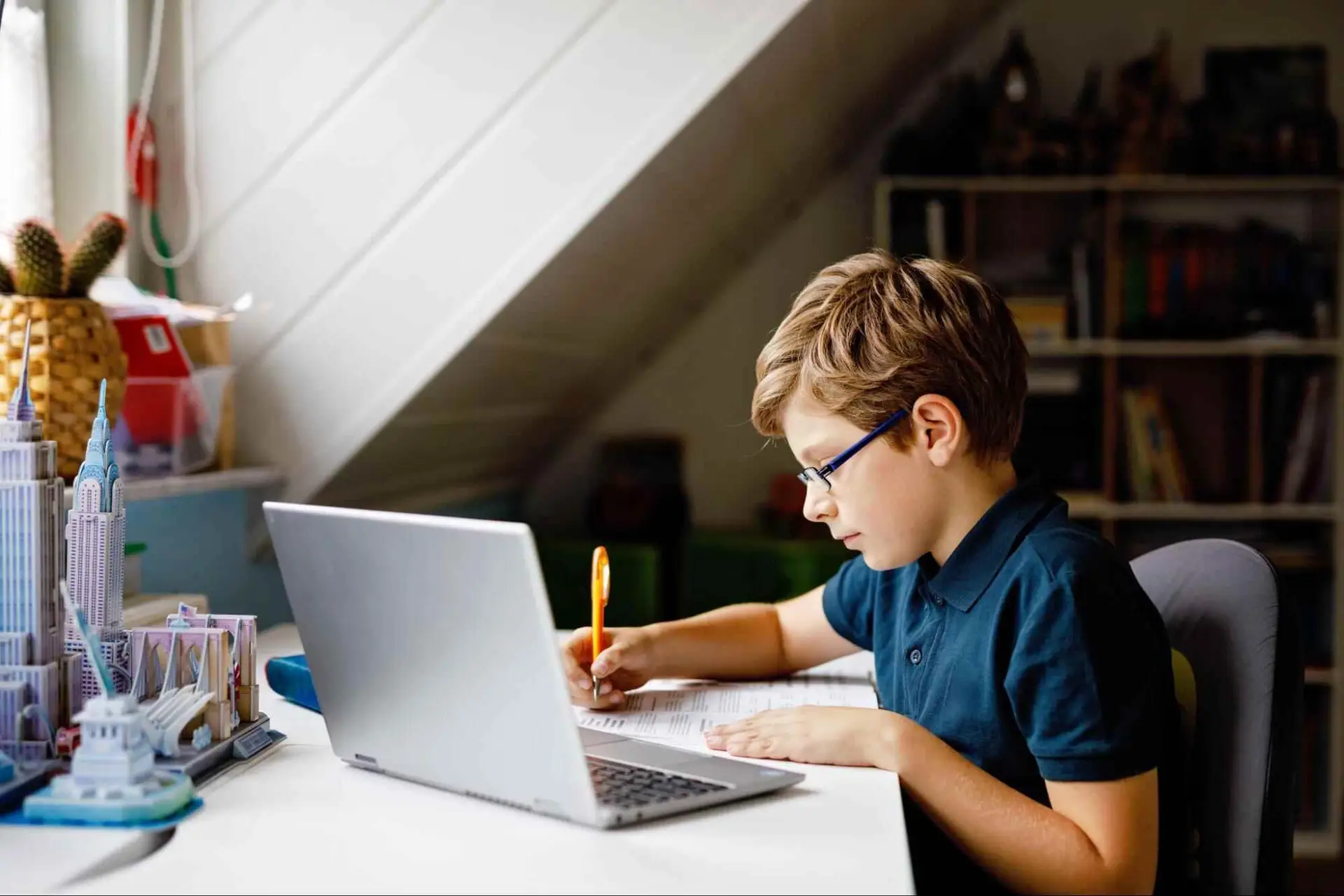 Child using a laptop for online learning at home, illustrating how fiber internet supports remote work, education, and reliable online connectivity.