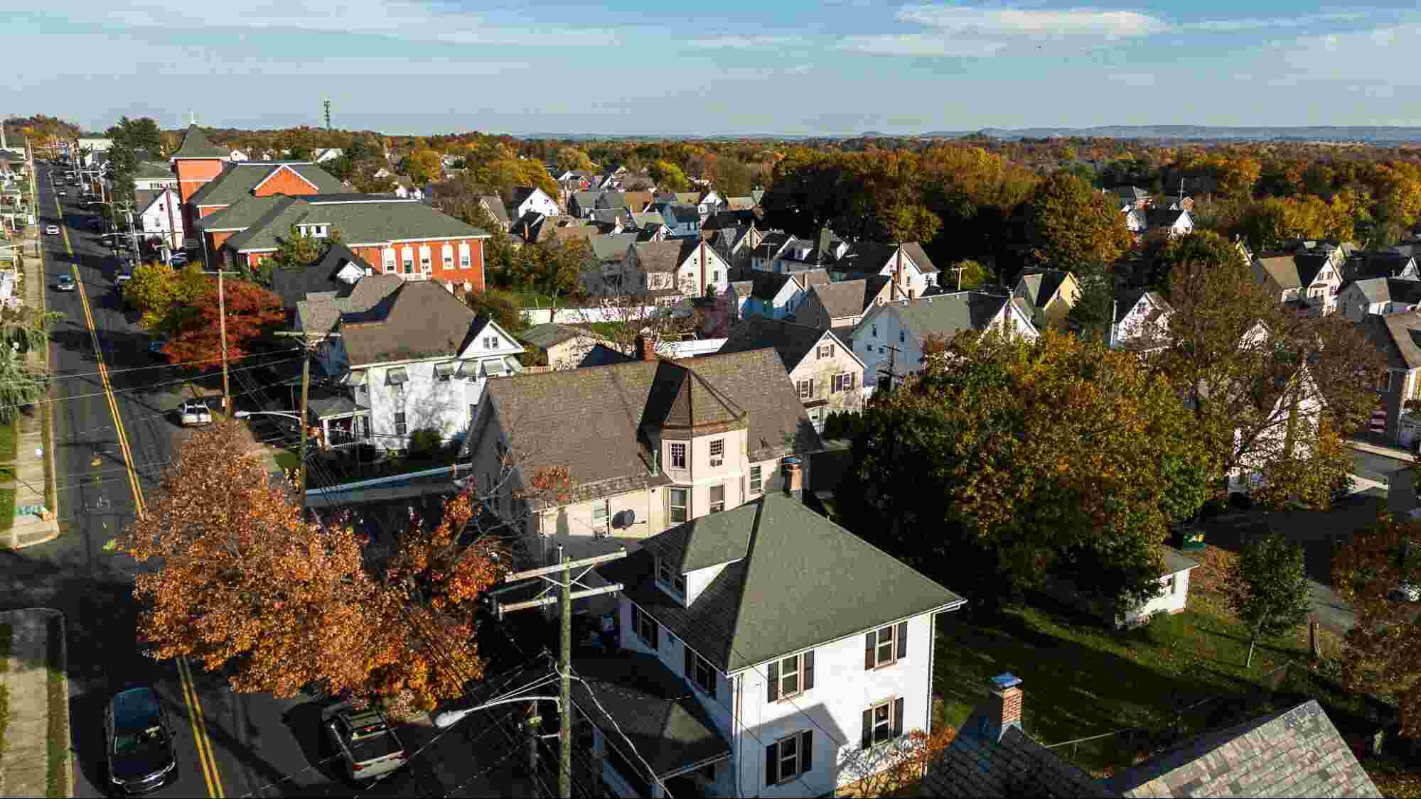Aerial view of a growing residential community, representing the long-term infrastructure and connectivity needed to support homes, businesses, and future development through fiber internet.