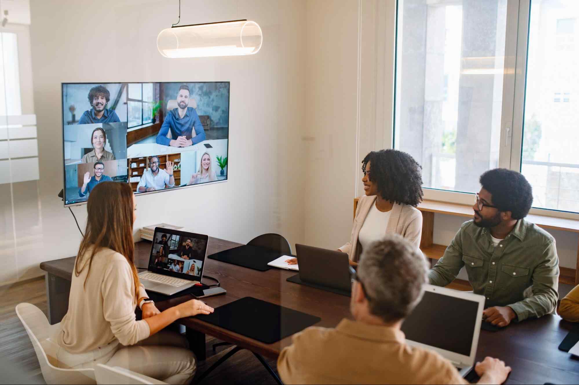 Team collaborating in a video conference, showing how fiber networks support critical communication and seamless business connectivity.