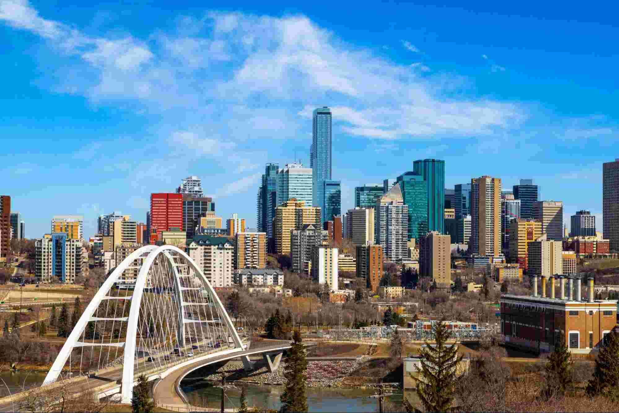 Modern city skyline highlighting communities investing in fiber infrastructure to support reliable, high-speed internet connectivity.
