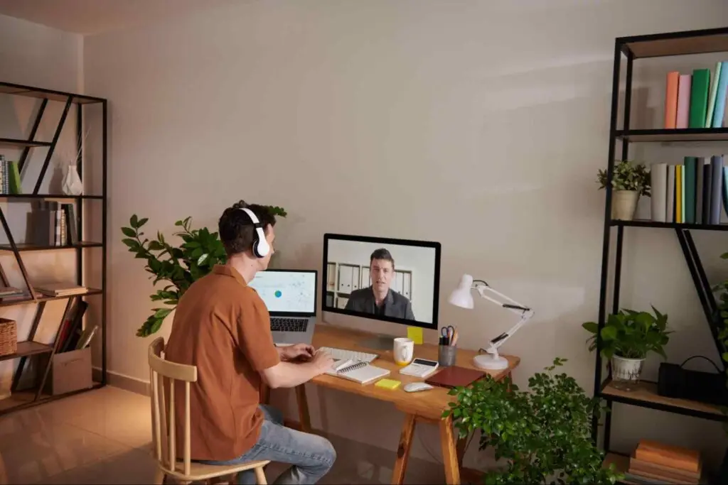 Remote worker participating in a video meeting from a home office, demonstrating how stronger uploads support everyday online tasks.