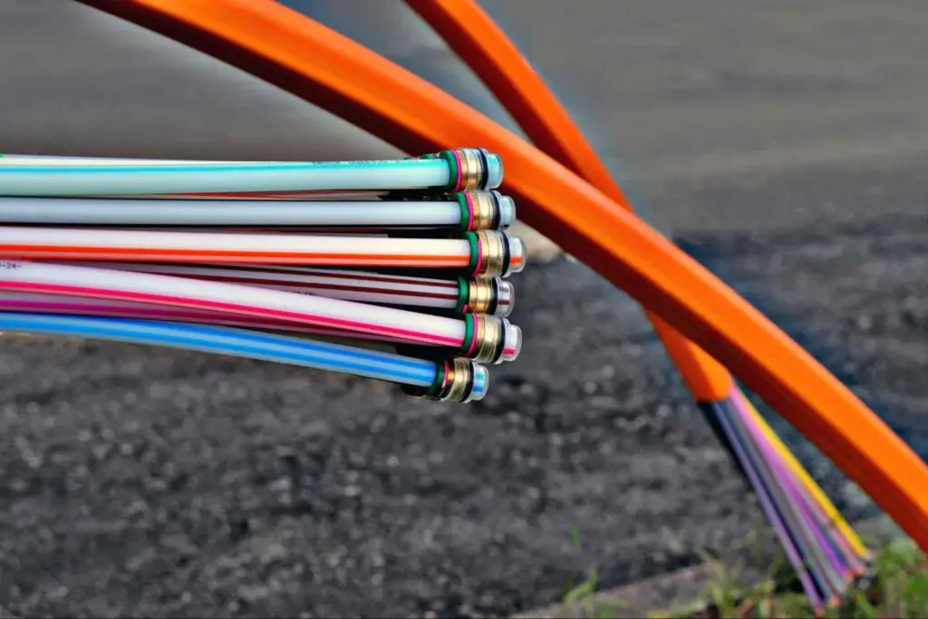 Underground fiber optic cable installation for community internet infrastructure.