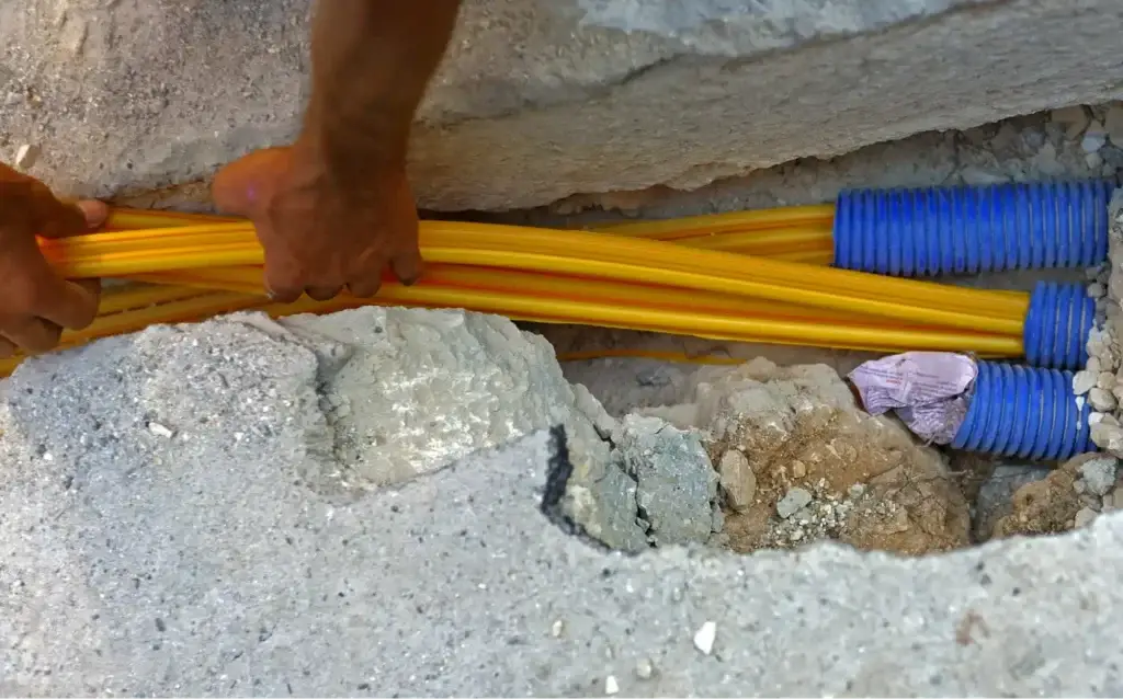 Fibre optic cables being installed underground, illustrating how Alberta weather can affect internet connection infrastructure.